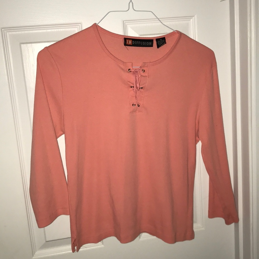 3/4 sleeve knit top. Cute lace up detail at neck